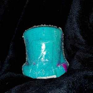 Mad Hatter bath bomb, with size 7 ring inside.